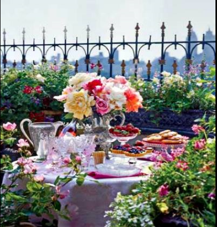 relaxing and colourful outdoor tablescape on a balcony in the summer