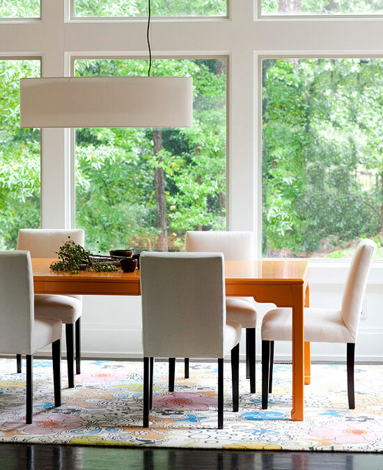 elegant and comfortable, clean lined dining room with large windows and rectangular lighting
