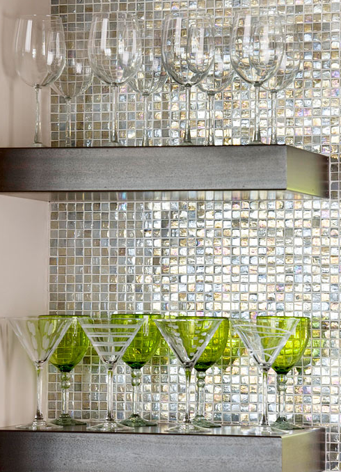 floating shelves on glass tile backsplash