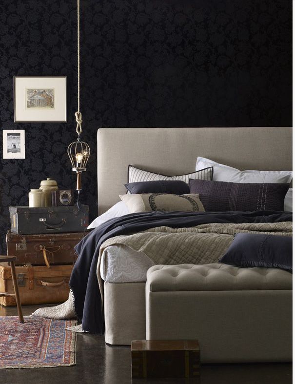 dramatic casual bedroom with black wallcovering feature wall