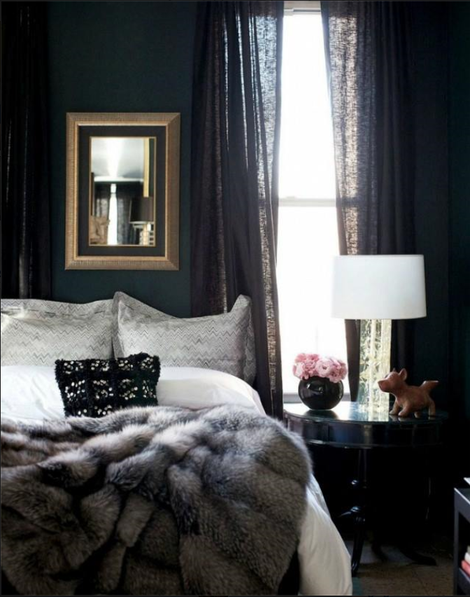 elegant and dramatic bedroom with faux fur throw and black semi-sheer custom draperies