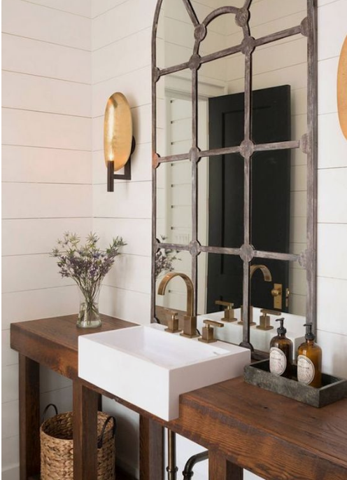 upscale rustic contemporary decor bathroom with metal mirror and thick wood vanity counter
