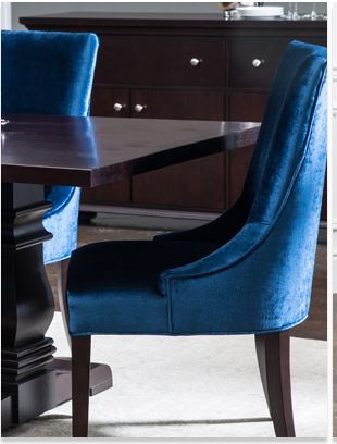 blue velvet dining chair in upscale dining room with espresso finish furniture