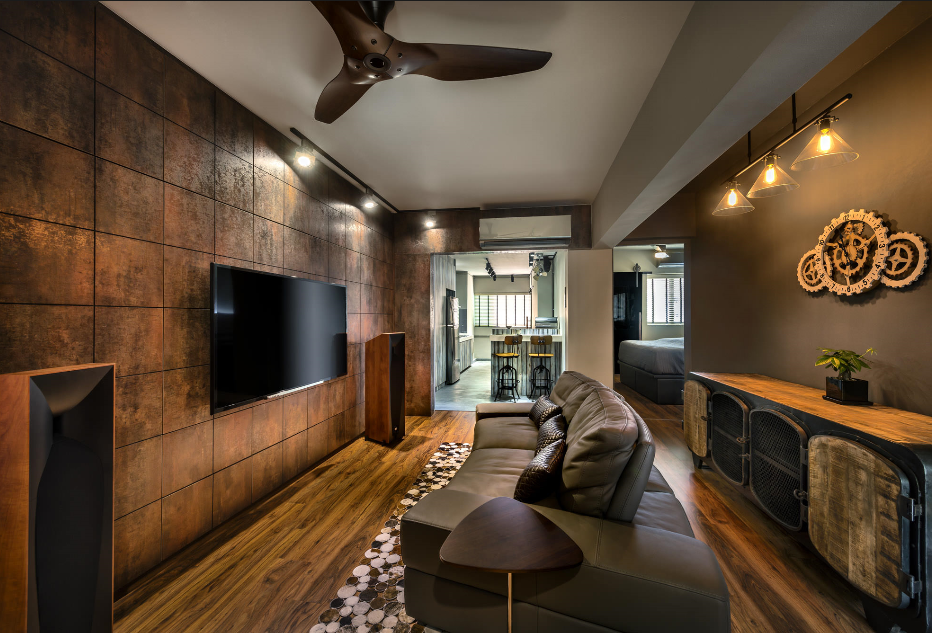upscale dramatic and relaxed comfortable family room with television wall tiled floor to ceiling, tan leather sofa, and edison bulb ceiling lighting