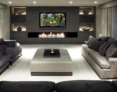 dramatic contemporary living room with charcoal feature wall with television and long, low fireplace