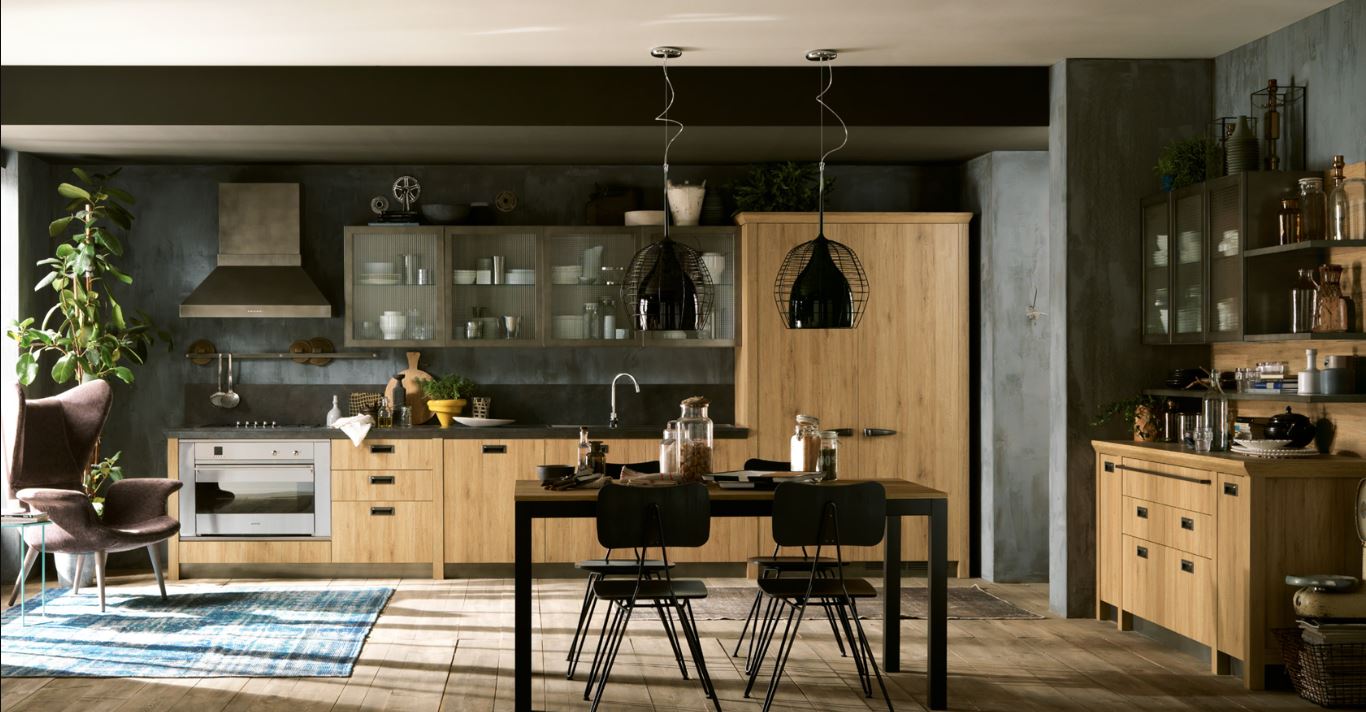 upscale urban chic loft style kitchen in light wood with concrete look finishes and black industrial lighting