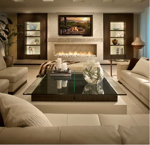 upscale living room in pale neutral colour palette with cream leather furniture, and contemporary fireplace with paired accent niches in dark neutral painted wood