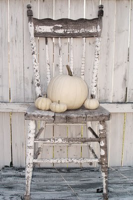 farm chair with white pumpkins and chipped paint